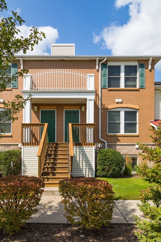 Townhome from outside with stairs and front porch