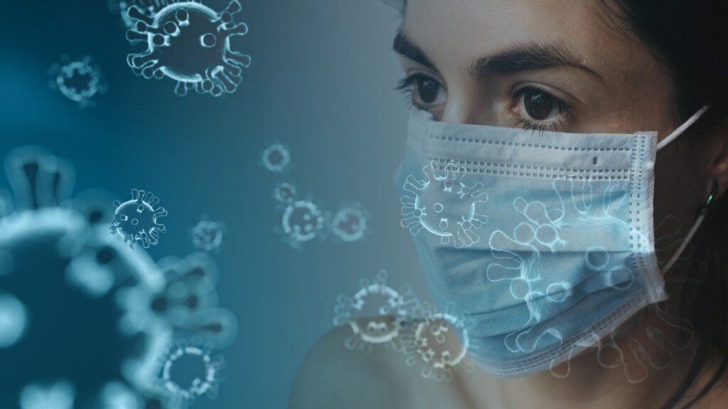 Person wearing mask with COVID-19 virus overlays