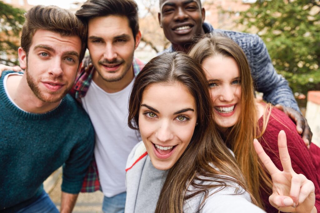 Group of friends having fun together outdoors