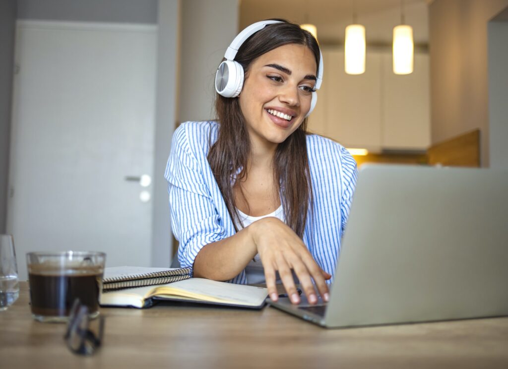 happy college girl on laptop